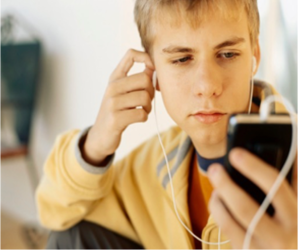 A young person looking at his phone