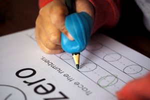 Young child completing a worksheet