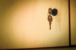 Locked cabinet with key hanging in the lock