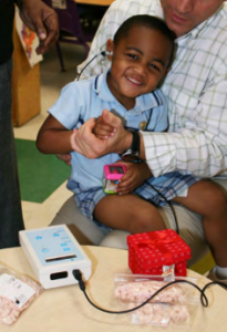 Young boy having his hearing checked.