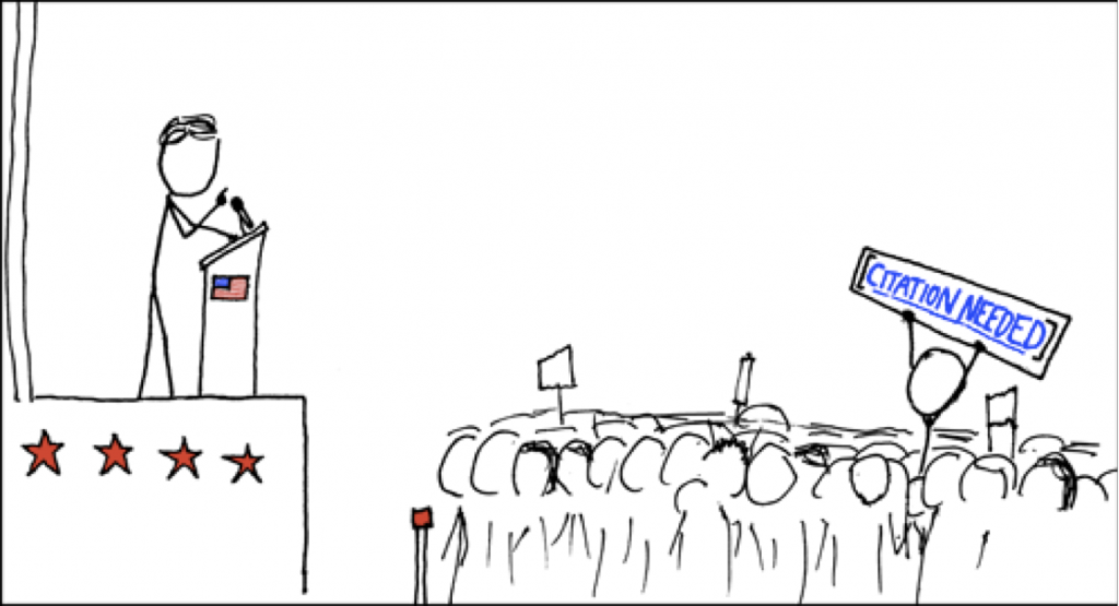 A stick figure drawing of a man giving a speech as an audience member in the crowd holds up a protest sign reading CITATION NEED.