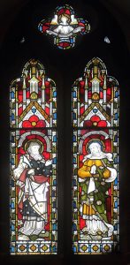 Window in the Lady Chapel of St Hilary's, Wallasey, showing Abraham and his wife Sarah.