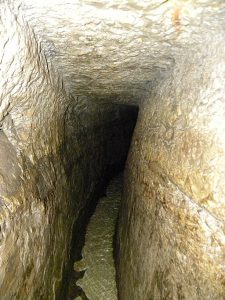 Inside "Hezekiah's tunnel," the 8th century water channel cut through bedrock right under the City of David. The channel brought water from the Gihon spring (on the north-eastern slope of the hill) to the Siloam pool at the southern tip of the city. King Hezekiah ordered construction of this water system to secure a water source inside the city walls in the face of the approaching Assyrian army. When the channel was finished, the entrance to the spring was covered over with rubble to prevent the Assyrians from using (or tampering with) the water. Jerusalem
