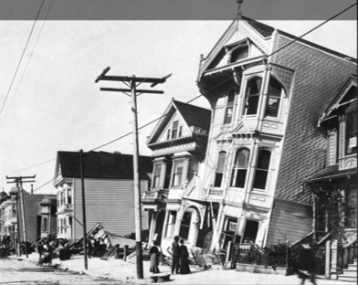 Old photograph of a large old house that has the ground floor halfway sunk below ground level due to liquefaction