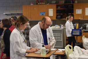 Nursing faculty in student lab